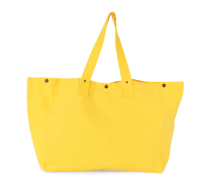 Acessório Camale The Origin Camale Tote em tecido colorido com alças de ombro e detalhes em tons de amarelo e azul.